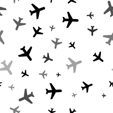 Seamless vector pattern with plane symbols, creating a creative monochrome background with rotated elements. Illustration on transparent background