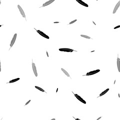 Fototapeta premium Seamless vector pattern with feather symbols, creating a creative monochrome background with rotated elements. Vector illustration on white background