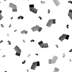Seamless vector pattern with playing cards symbols, creating a creative monochrome background with rotated elements. Vector illustration on white background