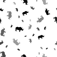 Seamless vector pattern with rhino symbols, creating a creative monochrome background with rotated elements. Illustration on transparent background