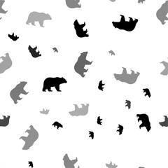 Seamless vector pattern with bear symbols, creating a creative monochrome background with rotated elements. Vector illustration on white background