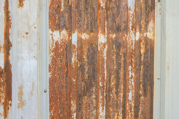 Rustic zinc or iron sheet material fence wall. Background and textured surface.