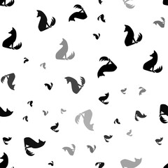 Seamless vector pattern with fox symbols, creating a creative monochrome background with rotated elements. Vector illustration on white background