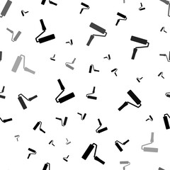 Seamless vector pattern with paint roller symbols, creating a creative monochrome background with rotated elements. Illustration on transparent background