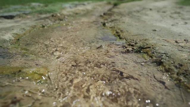 Crystal clear, clean mineral spring water in the churchyard of St. Petka, at the base of Kozhuh mountain, situated in the town of Rupite, Petrich in Bulgaria.