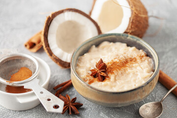 Spanish rice pudding Arroz con Leche in  cream bowl on the table - obrazy, fototapety, plakaty