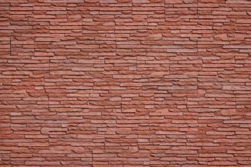 Red brick wall pattern tile background.