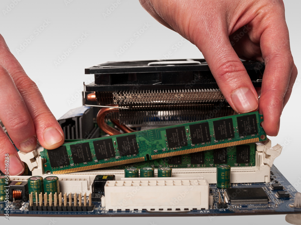 Poster hand holding ram modules to assemble a computer, choosing the right components for a computer, types