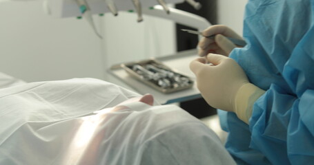 Dental treatment close-up. A dentist performs a dental procedure. Dentist's hands at work. Oral...
