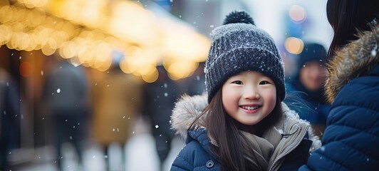  young Asian baby girl with father closeup portrait smiling at Christmas festival at night time with bokeh light, winter fun fair happiness time, Generative Ai