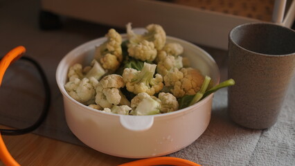 Top view of sorting Cauliflower and green vegetables in the bowl