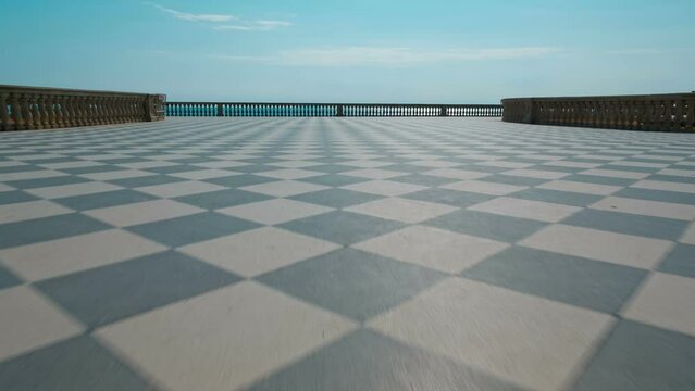 Low angle POV shot of the amazing Terrazza Mascagni in the amazing Tuscan city of Livorno, Italy. Built in the 1920s, the Terrazza is a chequered belvedere facing the sea with 8,700 sq. m.