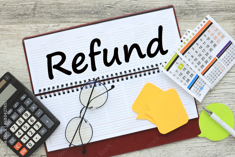 Aufkleber refund notepad with text near calculator and calendar