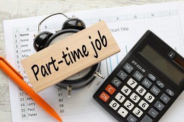 Part time jobs announcement. text on a wooden block. on the table clock
