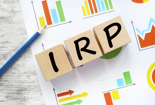 IRP. pencil pointing to text on wooden blocks