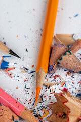 sharp pencil of different colors on paper close-up