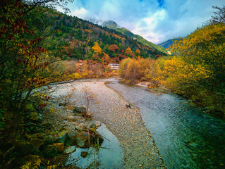 Kamikochi National Park in the Northern Japan Alps of Nagano Prefecture, Japan. Beautiful mountain in autumn leaf and Azusa river