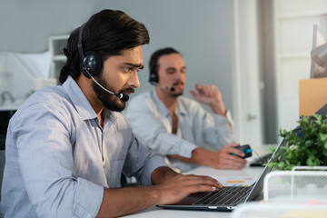 Indian customer service agent supporting customer by communicating information via headphone. Businessman on conference call with coworker and management, online quarterly result presenting. 