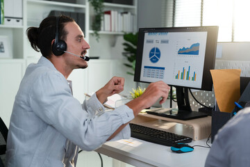 Employee worker conference call with management and colleague, presenting chart data analysis marketing trend and actual with exciting emotion. Businessman use headsets to communicate with coworkers.