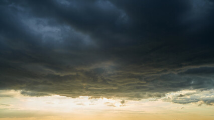 Weather changes from cumulus clouds to a thunderstorm front.