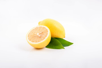 Half and whole lemons on a white background.