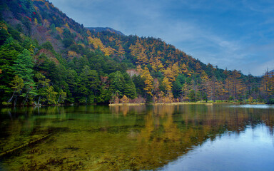 Idyllic landscape of Myojin pond at Hotaka Rear shrine in Kamikochi, Nagano, Japan (Japanese language meaning 