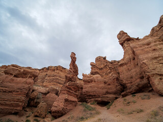 Fototapeta na wymiar Charyn Canyon National Park. An area called the Valley of Castles. Red rock formations formed as a result of erosion over millions of years. A small replica of the US Grand Canyon.