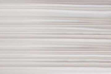 White textile texture, background with horizontal drapery, stripes or rows