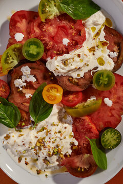 salad with different varieties of tomatoes and strachiatella
