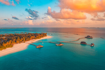 Amazing aerial beach landscape. Beautiful Maldives sunset seascape view. Horizon colorful sea sky...