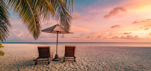 Amazing beach. Romantic chairs umbrella on sandy beach palm tree leaves, sun sea sky. Summer...