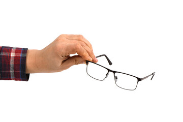 Hand holding plastic black glasses, isolated on white background.