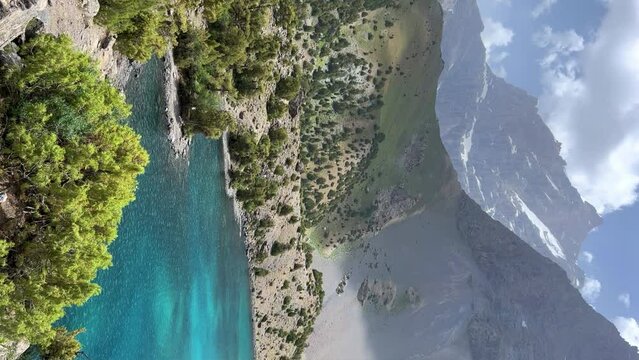 The Alaudin (Chapdara) lakes, lying at an altitude of 2800 m, are considered one of the most beautiful lakes of the Fan Mountains. Turquoise mountain lake. Pamiro-Alai. Tajikistan, Pamir 4K