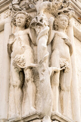 Adam and Eve statue with Tree of Knowledge on Doge's Palace in Venice