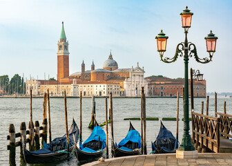 Venice gondolas in classical view with white church in background