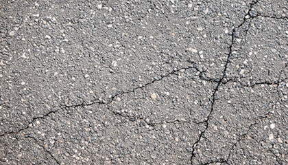 Obraz premium Gray asphalt with cracks as a background.