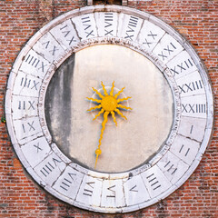 24-hours clock dial with golden hand on tower of San Giacomo di Rialto