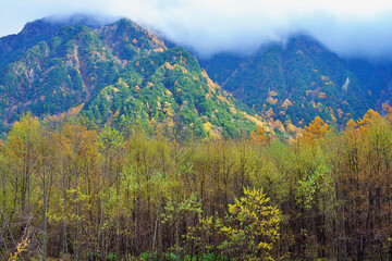 Kamikochi National Park in the Northern Japan Alps of Nagano Prefecture, Japan. Beautiful mountain in autumn leaf and Azusa river