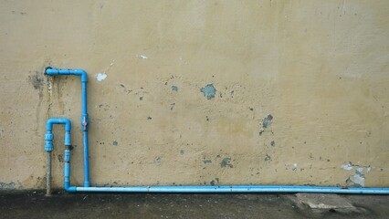 Water pipe on the cement wall with copy space for add text.Space background using put text or document