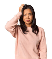 Fototapeta premium Young Filipina with long black hair in studio tired and very sleepy keeping hand on head.