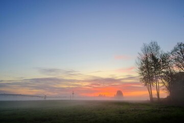 Naklejka na ściany i meble 4K Image: Serene Early Morning Landscape on the Farmstead - Rural Tranquility at Sunrise