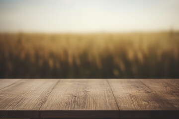 a dark wooden table top with a blurred wheat field background