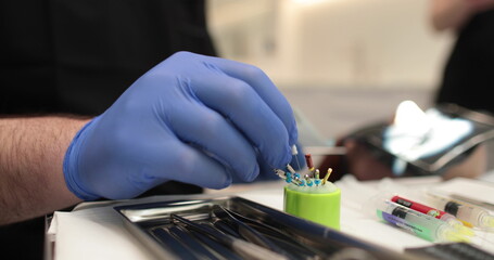 Protaper needles that a nurse prepares for use by a doctor in dentistry.