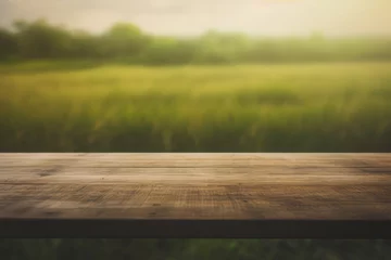Foto op Plexiglas a dark wooden table top with a blurred wheat field background © Suplim