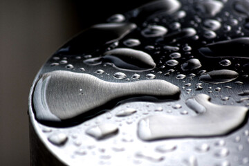 Macro water drops on a metal surface