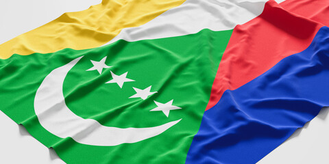 Flag of Comoros. Fabric textured Comoros flag isolated on white background. 3D illustration