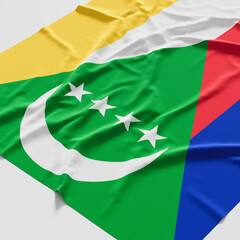 Flag of Comoros. Fabric textured Comoros flag isolated on white background. 3D illustration