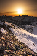 Sunset over the rocky peaks in the High Tatras