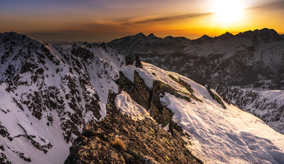Sunset over the rocky peaks in the High Tatras