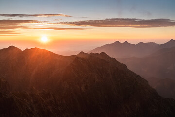 Sunset over the rocky peaks in the High Tatras - obrazy, fototapety, plakaty